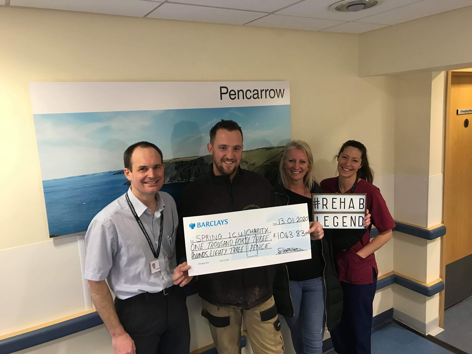 Simon, who runs Createscape, handing over a charity donation at a local hospital